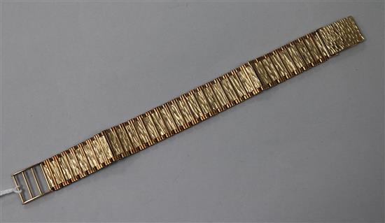 A 1970s 9ct gold bark effect flat link bracelet, approx 18cm.